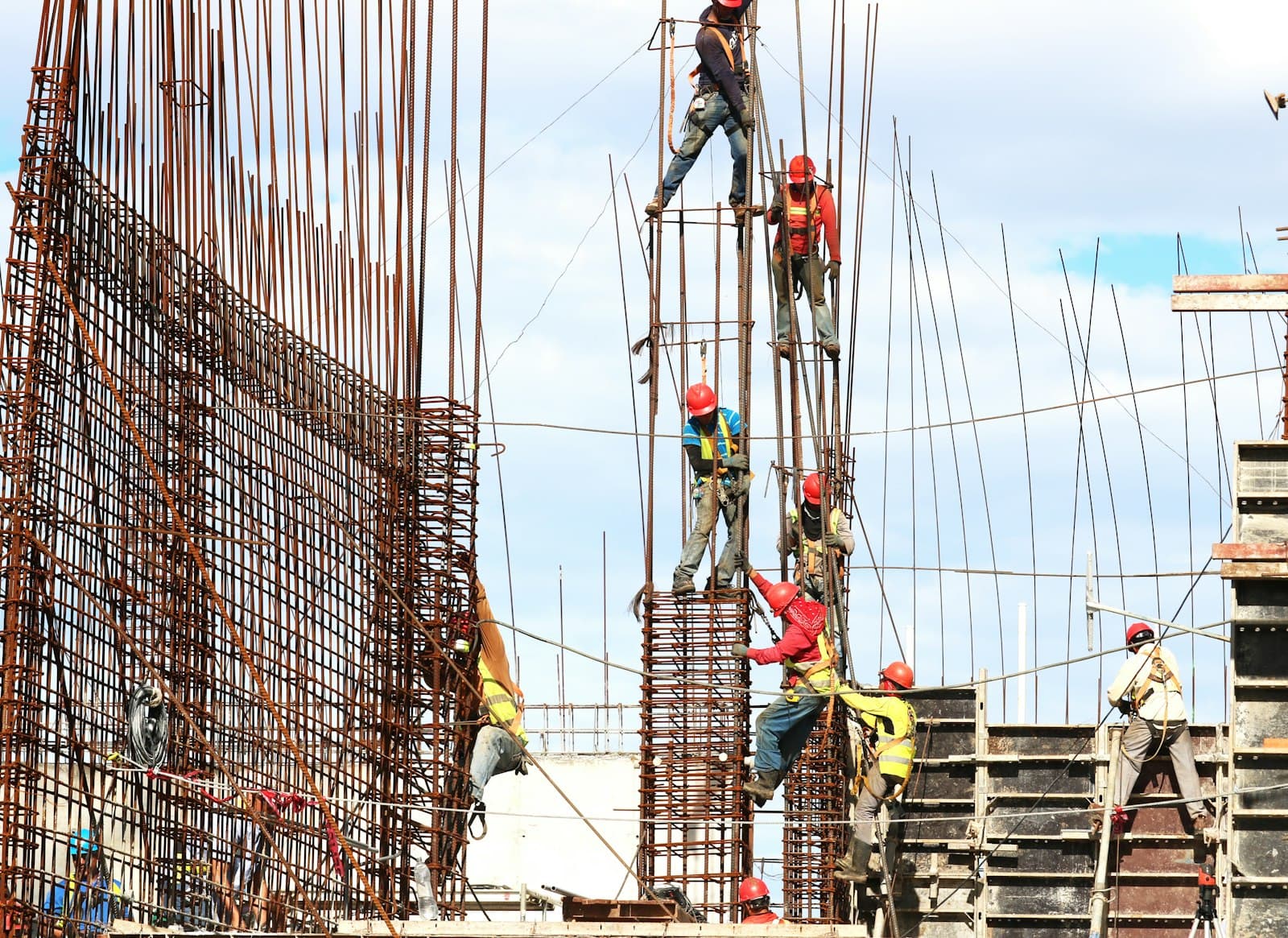 Construction team working on reinforcement steel at a building site