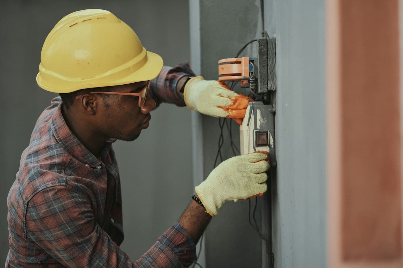 Technician in hard hat working on an installation